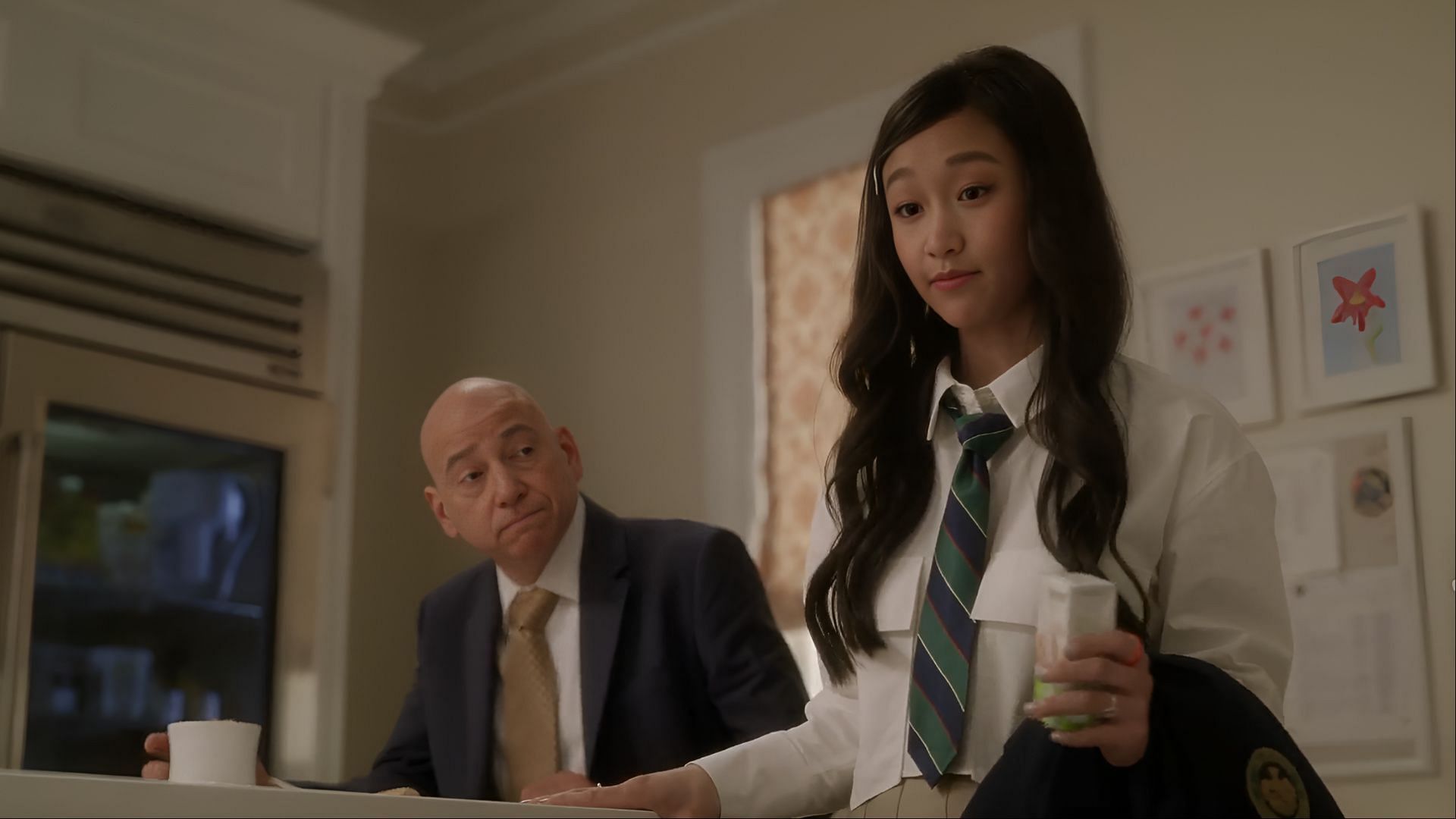 Lily Goldenblatt shares a moment with her father, Harry, at the breakfast counter in And Just Like That season 3 (Image via Now)